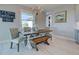Bright dining room with rustic table, bench, and chandelier at 2239 Cornelius Blvd, Port Charlotte, FL 33953