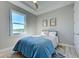 Cozy bedroom with a comfortable bed, water view, and stylish decor at 2239 Cornelius Blvd, Port Charlotte, FL 33953