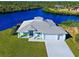Waterfront home boasting a two-car garage and canal views at 2239 Cornelius Blvd, Port Charlotte, FL 33953
