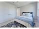 Bedroom with a queen-size bed and blue rug at 2239 Cornelius Blvd, Port Charlotte, FL 33953