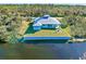 Aerial view of waterfront home with expansive backyard and seawall at 2239 Cornelius Blvd, Port Charlotte, FL 33953