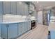 Modern kitchen with gray cabinets and a stainless steel refrigerator at 2239 Cornelius Blvd, Port Charlotte, FL 33953