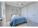 Bright bedroom with a queen bed, double closets, and decorative accents at 2239 Cornelius Blvd, Port Charlotte, FL 33953