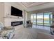 Living room with fireplace, water views, and comfortable seating at 2239 Cornelius Blvd, Port Charlotte, FL 33953