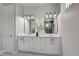 Double vanity bathroom with modern white cabinets and quartz countertop at 2239 Cornelius Blvd, Port Charlotte, FL 33953