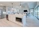Open concept kitchen with island, stainless steel appliances, and white cabinetry at 2239 Cornelius Blvd, Port Charlotte, FL 33953