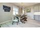 Bright dining room with farmhouse table and bench seating at 2239 Cornelius Blvd, Port Charlotte, FL 33953