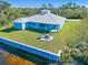 Waterfront property with a spacious backyard and fire pit area at 2239 Cornelius Blvd, Port Charlotte, FL 33953