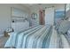 Main bedroom with white bed, dresser, and coastal decor at 2239 Cornelius Blvd, Port Charlotte, FL 33953