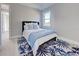 Bedroom with blue rug and a queen-size bed at 2239 Cornelius Blvd, Port Charlotte, FL 33953