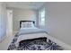 Bedroom with a queen-size bed and blue rug at 2239 Cornelius Blvd, Port Charlotte, FL 33953