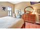Elegant bedroom with wood furniture, hardwood floors, and ample natural light at 96 Vivante Blvd # 96211, Punta Gorda, FL 33950