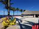 Colorful chairs and a tiki hut overlook the water at 96 Vivante Blvd # 96211, Punta Gorda, FL 33950