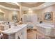 Bathroom with a large soaking tub, walk-in shower, and double vanity at 96 Vivante Blvd # 96211, Punta Gorda, FL 33950
