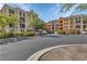 Condo building with Mediterranean-style architecture and lush landscaping at 96 Vivante Blvd # 96211, Punta Gorda, FL 33950
