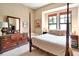 Spacious bedroom with a four-poster bed and lots of natural light at 96 Vivante Blvd # 96211, Punta Gorda, FL 33950