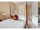 Bedroom with a four-poster bed and access to a bathroom at 96 Vivante Blvd # 96211, Punta Gorda, FL 33950