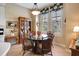Charming breakfast nook with a round table and wicker chairs at 96 Vivante Blvd # 96211, Punta Gorda, FL 33950