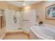 Bathroom with shower, soaking tub, and tile flooring at 96 Vivante Blvd # 96211, Punta Gorda, FL 33950