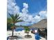 Relaxing beach area with thatch roof bar at 96 Vivante Blvd # 96211, Punta Gorda, FL 33950