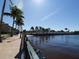 Scenic waterfront walkway with palm trees at 96 Vivante Blvd # 96211, Punta Gorda, FL 33950