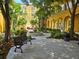 Relaxing courtyard with fountain, seating, and lush landscaping at 96 Vivante Blvd # 96211, Punta Gorda, FL 33950