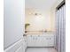 Well-lit bathroom features updated vanity, modern light fixtures and lots of cabinet space at 7456 Jennifer Dr, Port Charlotte, FL 33981
