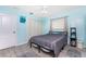 This cozy bedroom features luxury vinyl plank flooring and a closet for plenty of storage at 7456 Jennifer Dr, Port Charlotte, FL 33981