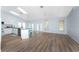 Open floor plan featuring a modern kitchen with an island connected to a spacious living area at 7456 Jennifer Dr, Port Charlotte, FL 33981