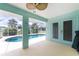 Covered patio with fan offering views of the pool and landscaped backyard at 7456 Jennifer Dr, Port Charlotte, FL 33981