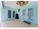 Covered patio with fan offering views of the pool and landscaped backyard at 7456 Jennifer Dr, Port Charlotte, FL 33981