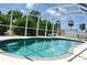 Enjoy this refreshing enclosed pool with abundant views and greenery at 7456 Jennifer Dr, Port Charlotte, FL 33981