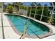 Inviting screened-in pool offers a relaxing retreat with clear blue water and ample lounging space at 7456 Jennifer Dr, Port Charlotte, FL 33981