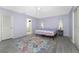 Spacious bedroom with lavender walls and a ceiling fan at 7456 Jennifer Dr, Port Charlotte, FL 33981