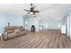 Living room offers an open layout and wood-look floors at 7456 Jennifer Dr, Port Charlotte, FL 33981