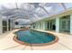 Stunning kidney-shaped pool with screened enclosure at 7456 Jennifer Dr, Port Charlotte, FL 33981