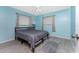 Bedroom with light blue walls, ceiling fan, and double bed at 7456 Jennifer Dr, Port Charlotte, FL 33981