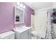 Bathroom with tub, shower, and purple walls at 3404 Penelope Ter, North Port, FL 34286