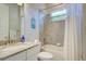 Cozy bathroom featuring a tub, tiled shower, and vanity with granite countertops at 15240 Spanish Point Dr, Port Charlotte, FL 33981