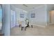 Dining room with tile flooring, a glass table, and modern pendant lighting at 15240 Spanish Point Dr, Port Charlotte, FL 33981