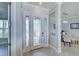 Foyer of home with decorative glass on front door and view of dining room at 15240 Spanish Point Dr, Port Charlotte, FL 33981