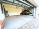 Spacious two-car garage with ample storage space and room for a workbench or other equipment at 15240 Spanish Point Dr, Port Charlotte, FL 33981