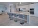 Spacious kitchen featuring a large island with seating and sleek countertops at 15240 Spanish Point Dr, Port Charlotte, FL 33981