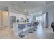 Open-concept kitchen with bar seating, stainless steel appliances, and tile floors at 15240 Spanish Point Dr, Port Charlotte, FL 33981