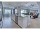 Kitchen and living room combination with seating and stainless steel appliances at 15240 Spanish Point Dr, Port Charlotte, FL 33981