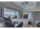 Comfortable living room with sliding glass doors leading to an outdoor patio and view of the water at 15240 Spanish Point Dr, Port Charlotte, FL 33981