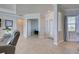 Open living room with view of office, foyer, and dining room at 15240 Spanish Point Dr, Port Charlotte, FL 33981