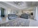 Open-concept living room showcasing tile flooring, furniture, and easy access to other areas at 15240 Spanish Point Dr, Port Charlotte, FL 33981