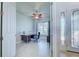 Office space with desk, chair, and a ceiling fan with decorative blades at 15240 Spanish Point Dr, Port Charlotte, FL 33981