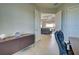 Office area leading into living room and sliding glass doors at 15240 Spanish Point Dr, Port Charlotte, FL 33981